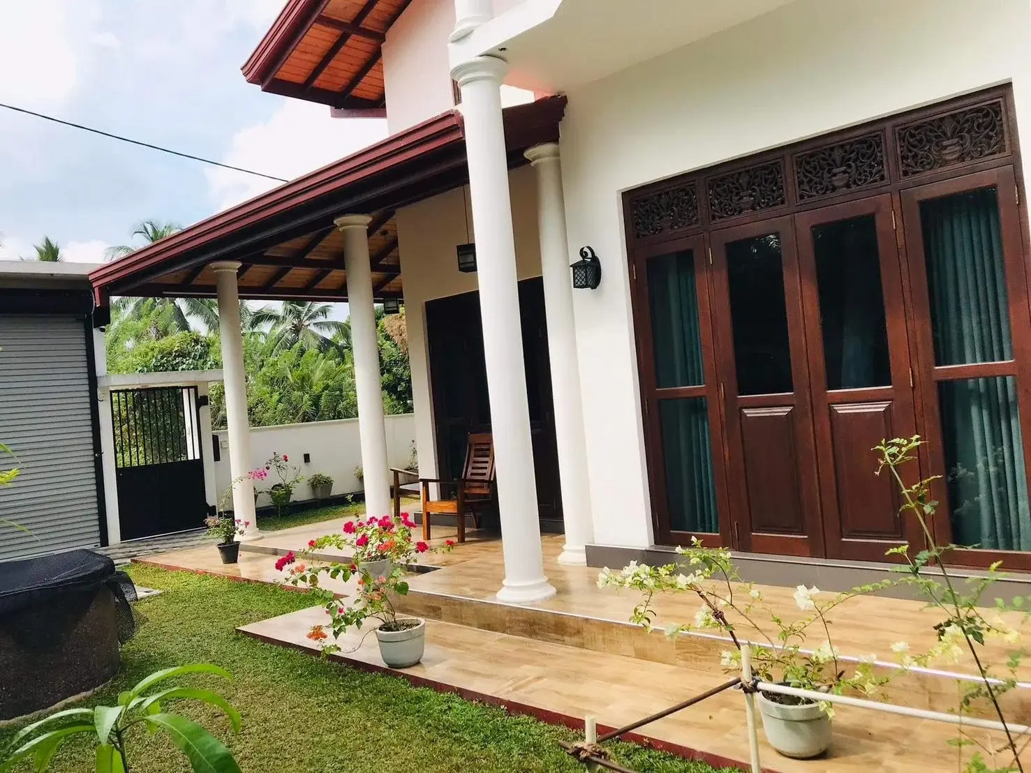 Another view of the homestay veranda and its small garden