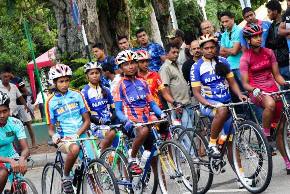 People cycling during a community event in Sri Lanka